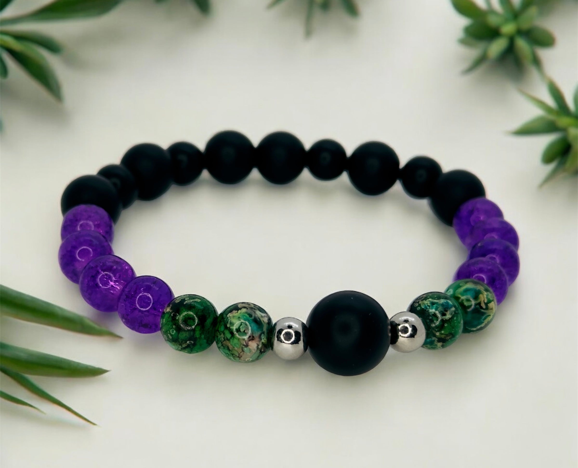 one beaded bracelet with small green plants around